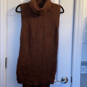 Sleeveless sweater or sweater vest.